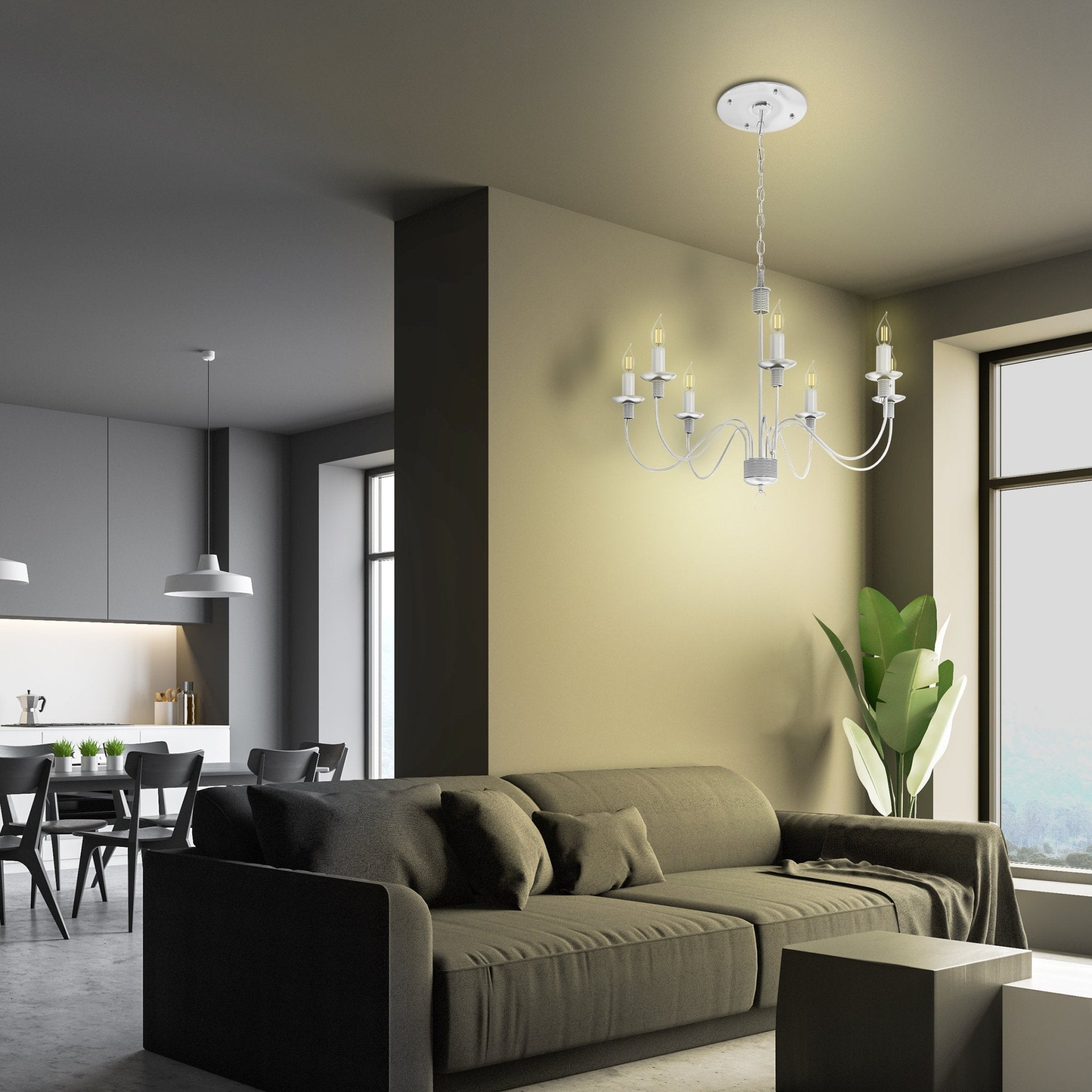 Modern living room with a chandelier, sofa, and kitchen in the background.