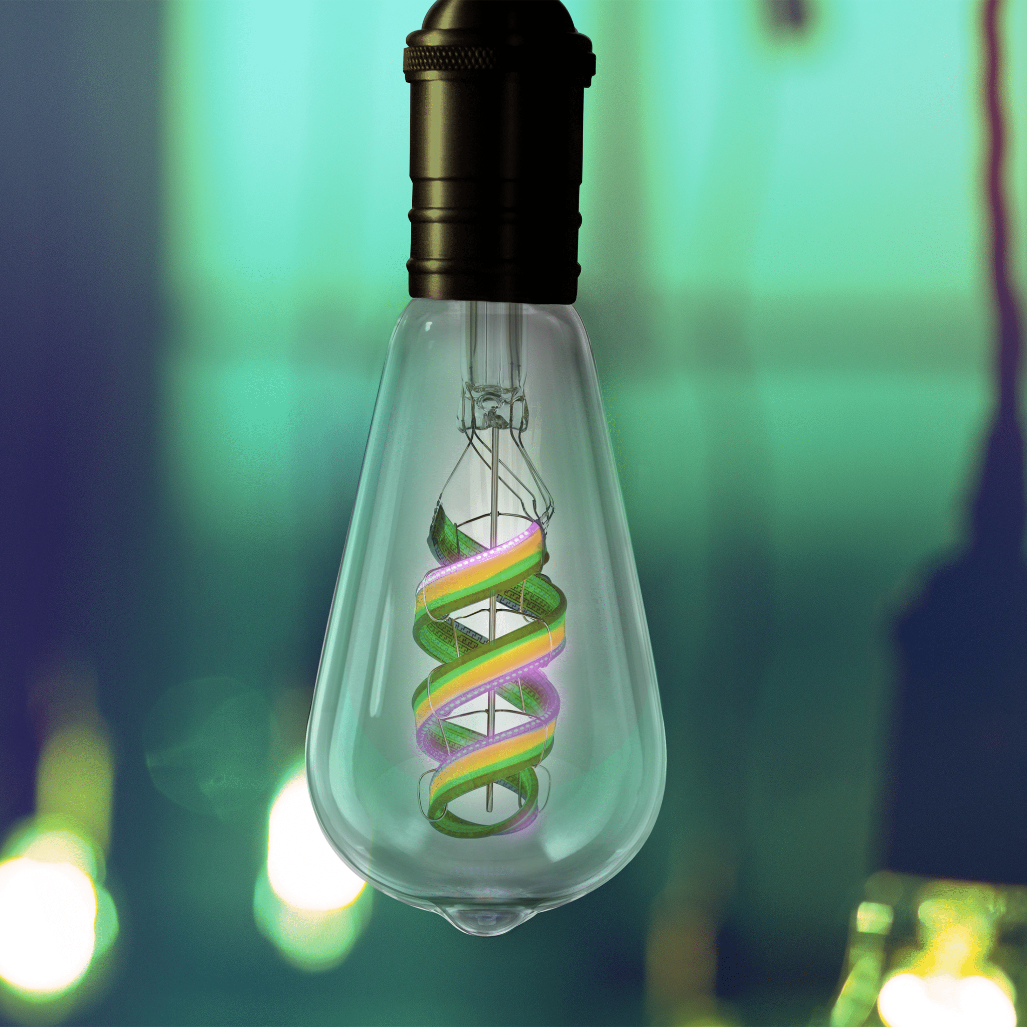 Decorative light bulb with colorful spiral design against a blurred background