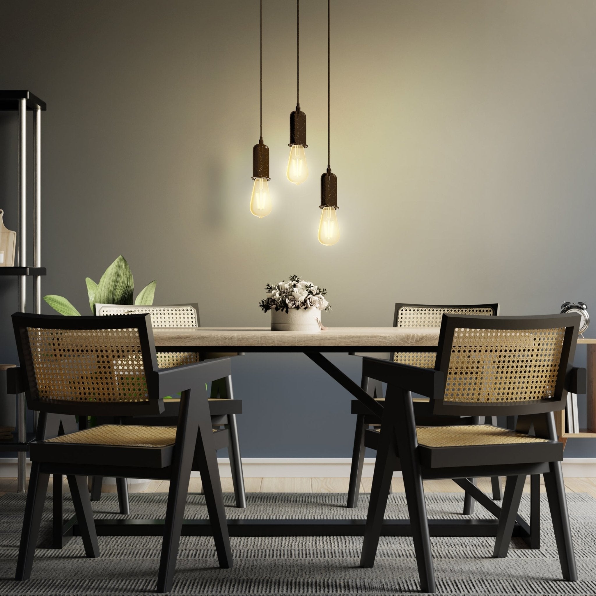 Dining room with a table and chairs under pendant lights.