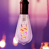 Decorative light bulb with colorful filament against a blurred background